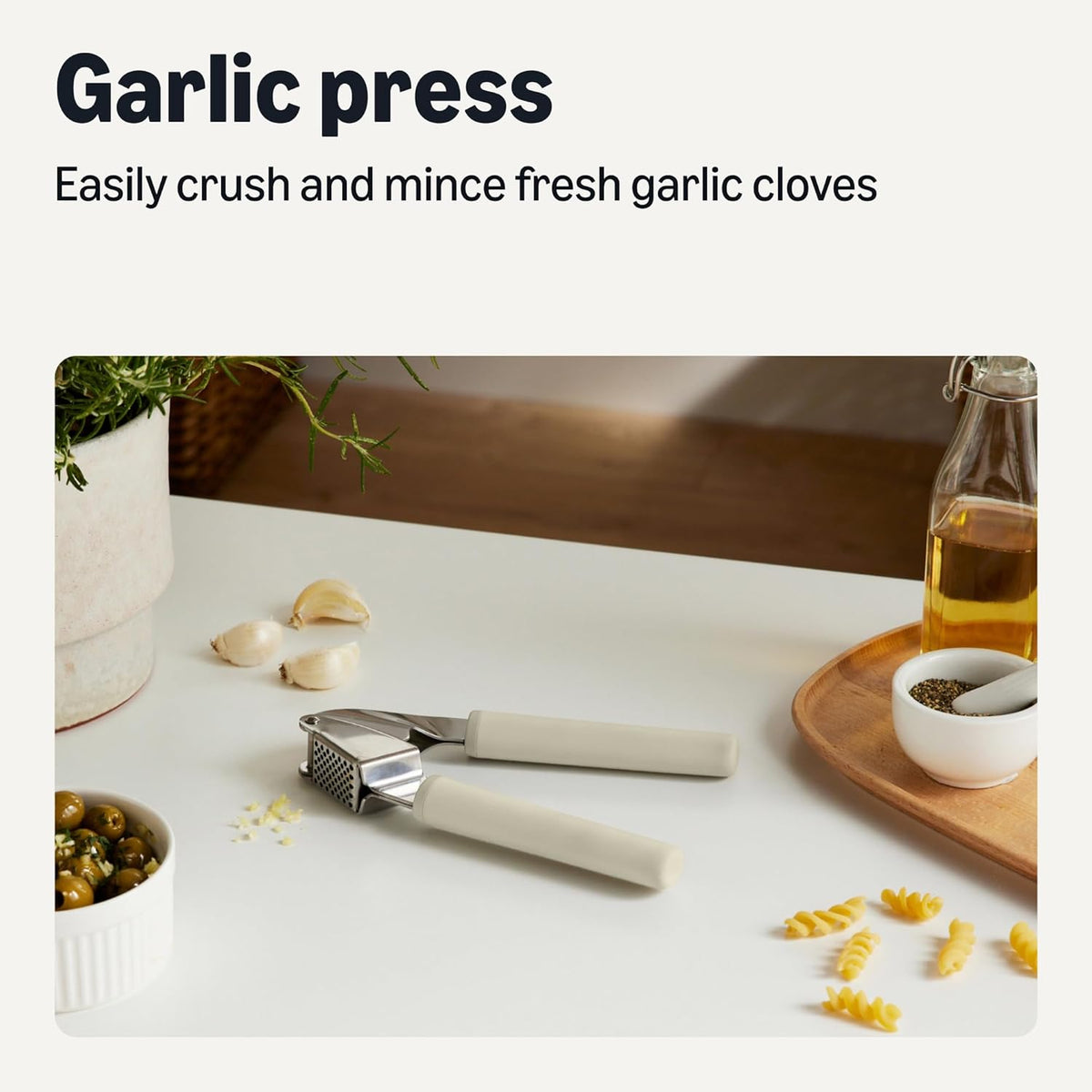 Amazon Basics Garlic Press, Stainless Steel, Soft Grip Handle, Dishwasher-Safe, Linen Gray