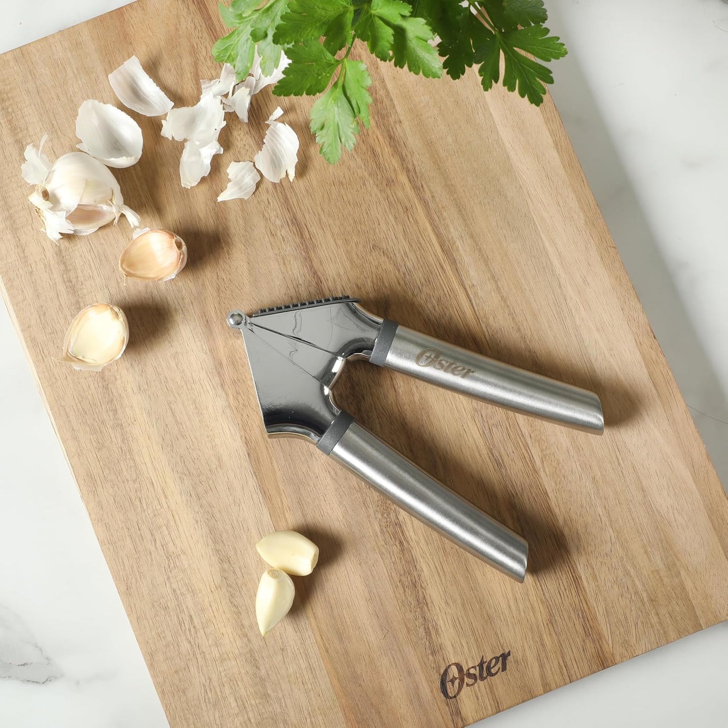 Oster Chadswyck 7.7” Garlic Press, Stainless Steel Garlic Mincer & Crusher, Easy Squeeze, Dishwasher Safe